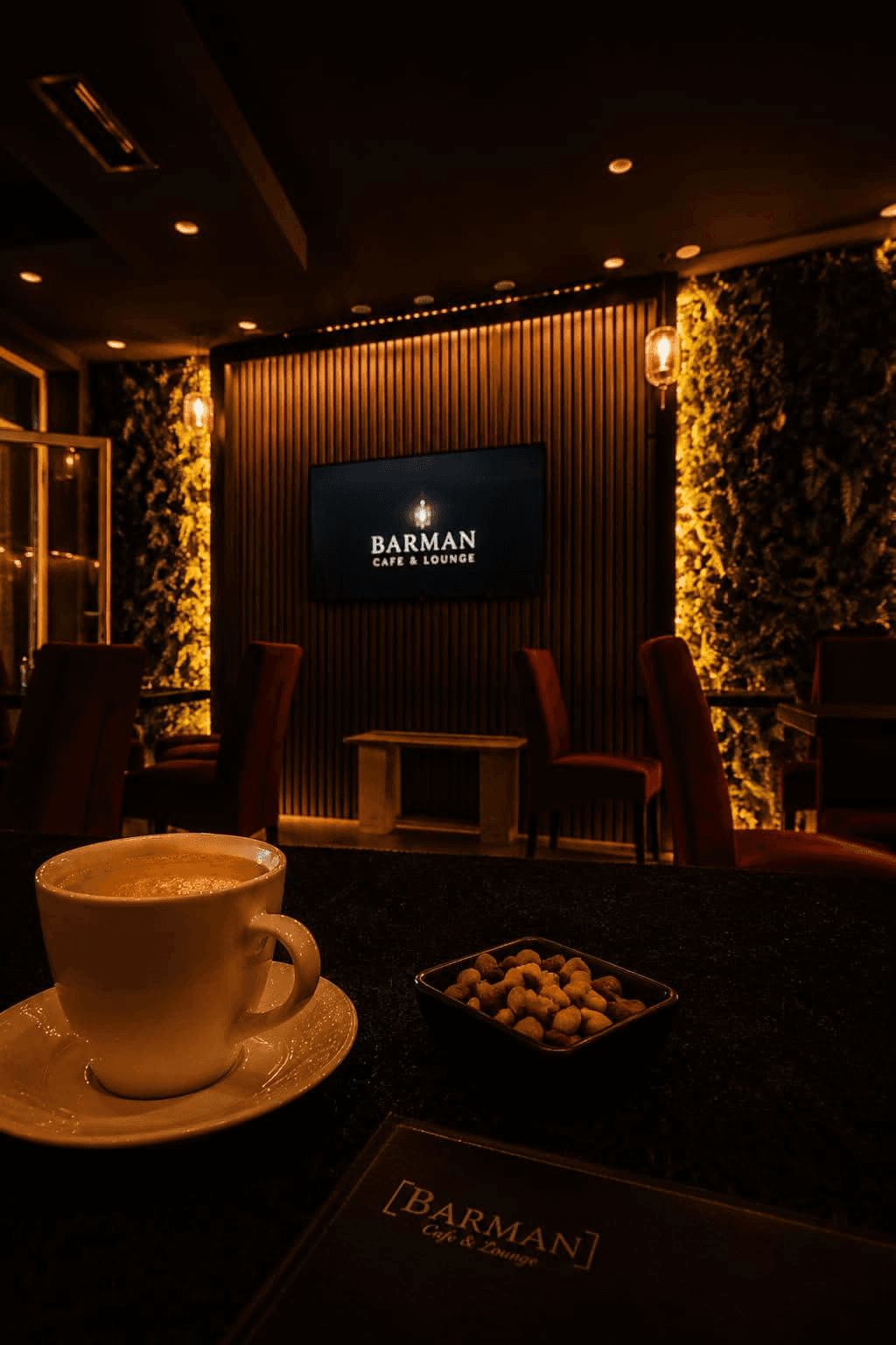 Barman Cafe interior – warm amber light, red velvet chairs, candle